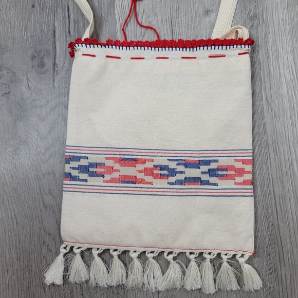 Boho fabric crossbody bag with knit string and flowers and fringe. 10"×9" - Picture 3 of 8